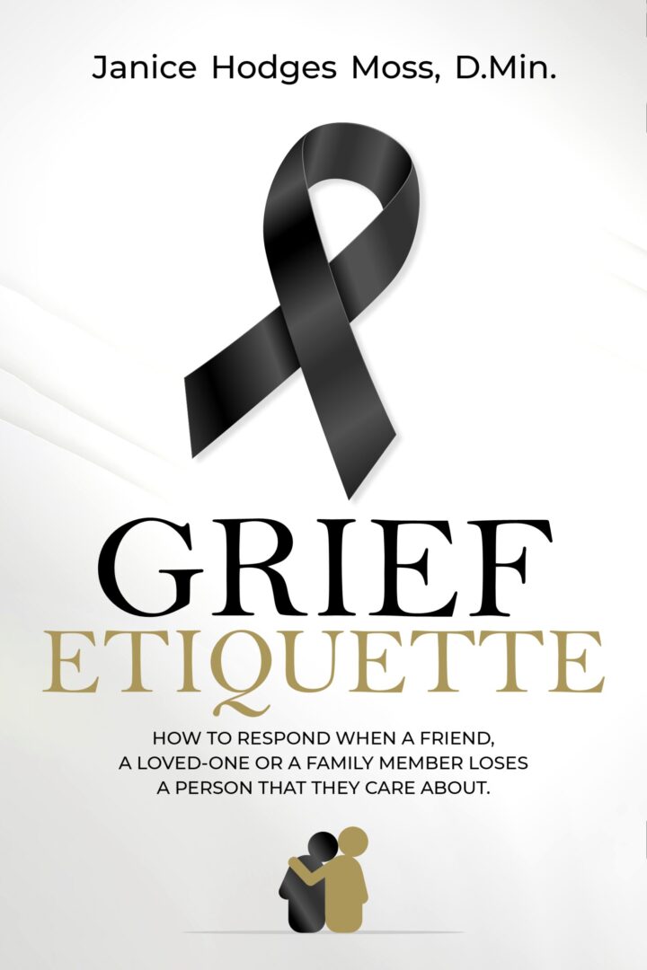 A black ribbon with the words grief etiquette written on it.